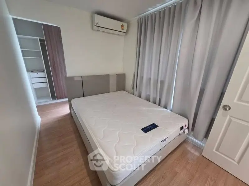Spacious bedroom with modern design and ample natural light