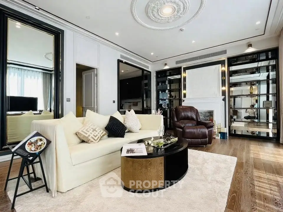 Luxurious living room with elegant decor, plush seating, and stylish mirrors.