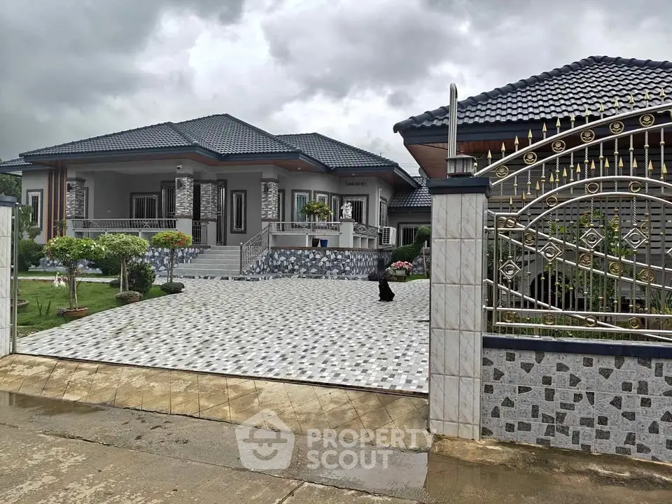 Luxurious modern house with elegant driveway and landscaped garden, showcasing stunning architectural design.