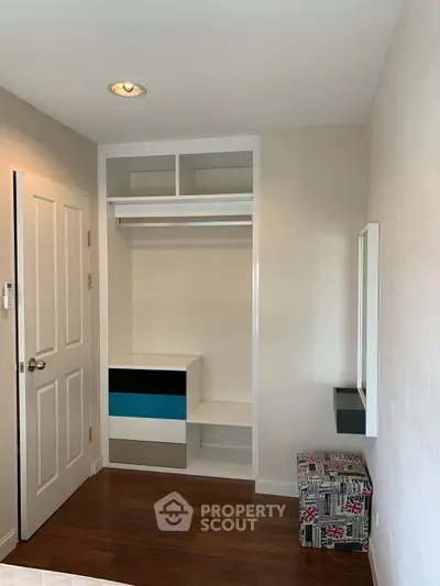 Modern bedroom with built-in closet and stylish decor