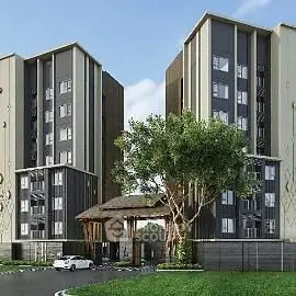 Modern apartment complex with lush greenery and sleek architecture.