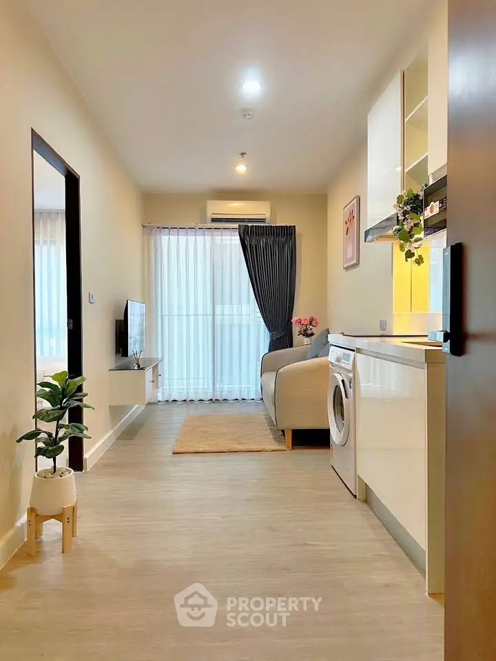 Modern living room with washing machine and stylish decor