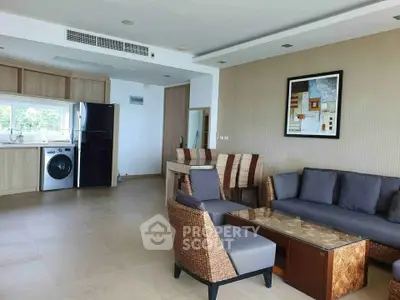 Spacious modern living room with open kitchen and stylish furniture