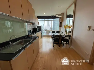 Modern kitchen with open layout and city view from dining area