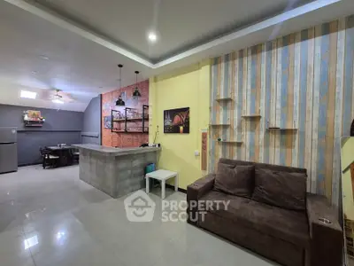 Modern open-plan living room with stylish decor and spacious layout