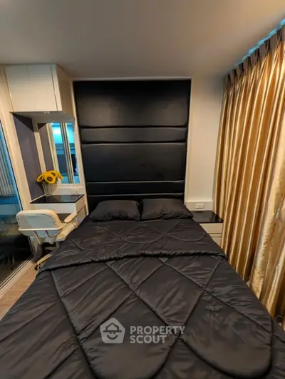 Modern bedroom with sleek black bedding and stylish decor