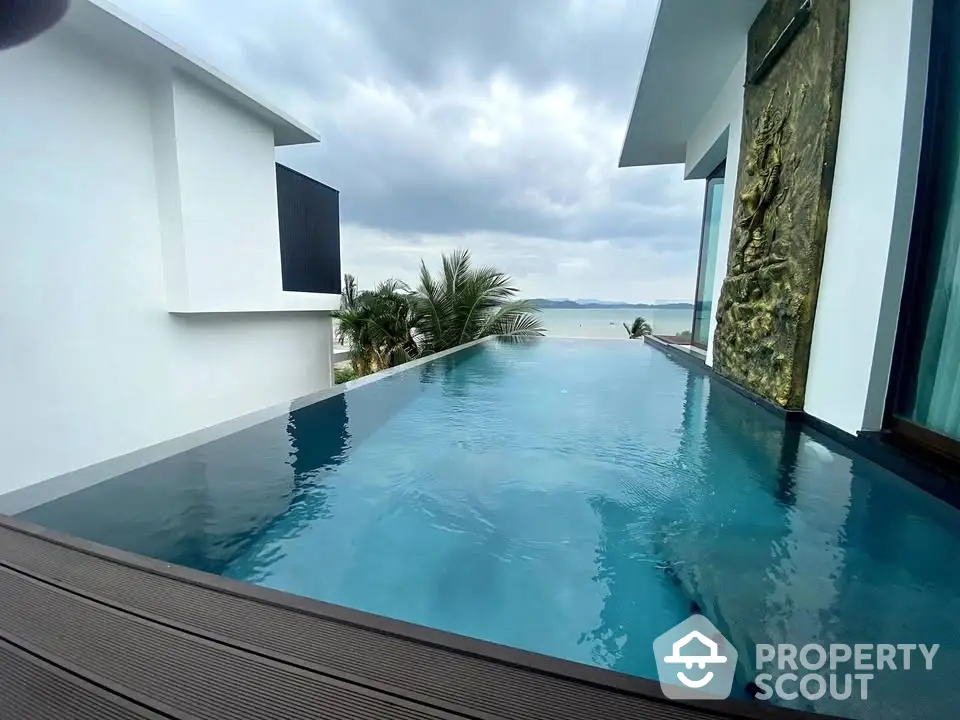 Luxurious infinity pool with stunning ocean view in modern villa