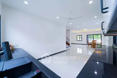 Spacious modern kitchen with sleek black countertops and open layout