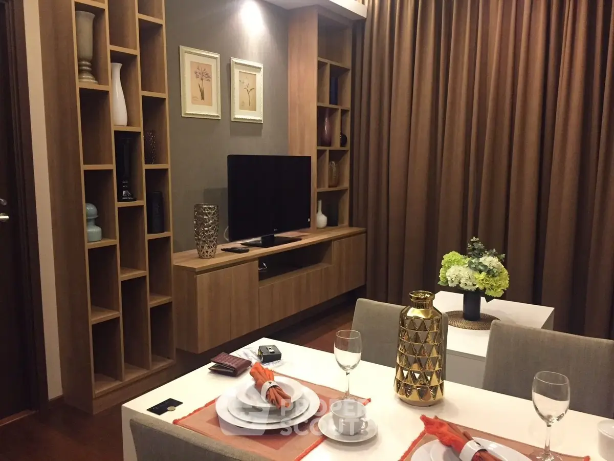 Elegant living room with modern decor and dining setup