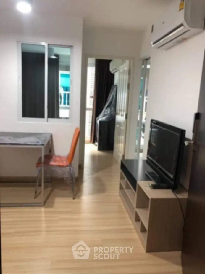 Modern apartment interior with wooden flooring and air conditioning