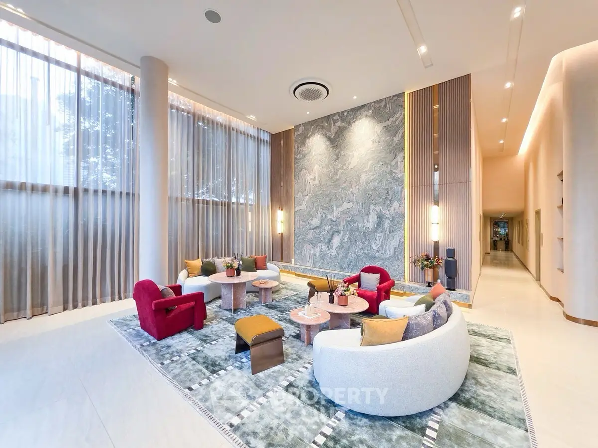 Luxurious modern living room with elegant decor and large windows