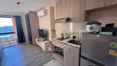 Modern studio apartment with open kitchen and balcony view
