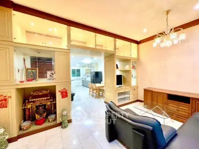 Spacious living room with elegant decor and open kitchen layout