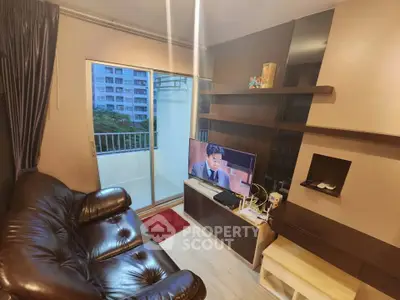 Cozy living room with leather sofa and balcony view in modern apartment