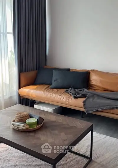 Stylish living room with leather sofa and modern coffee table