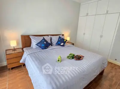 Cozy bedroom with modern decor and ample storage space