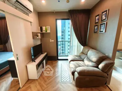 Modern living room with cozy sofa and city view balcony in high-rise apartment.