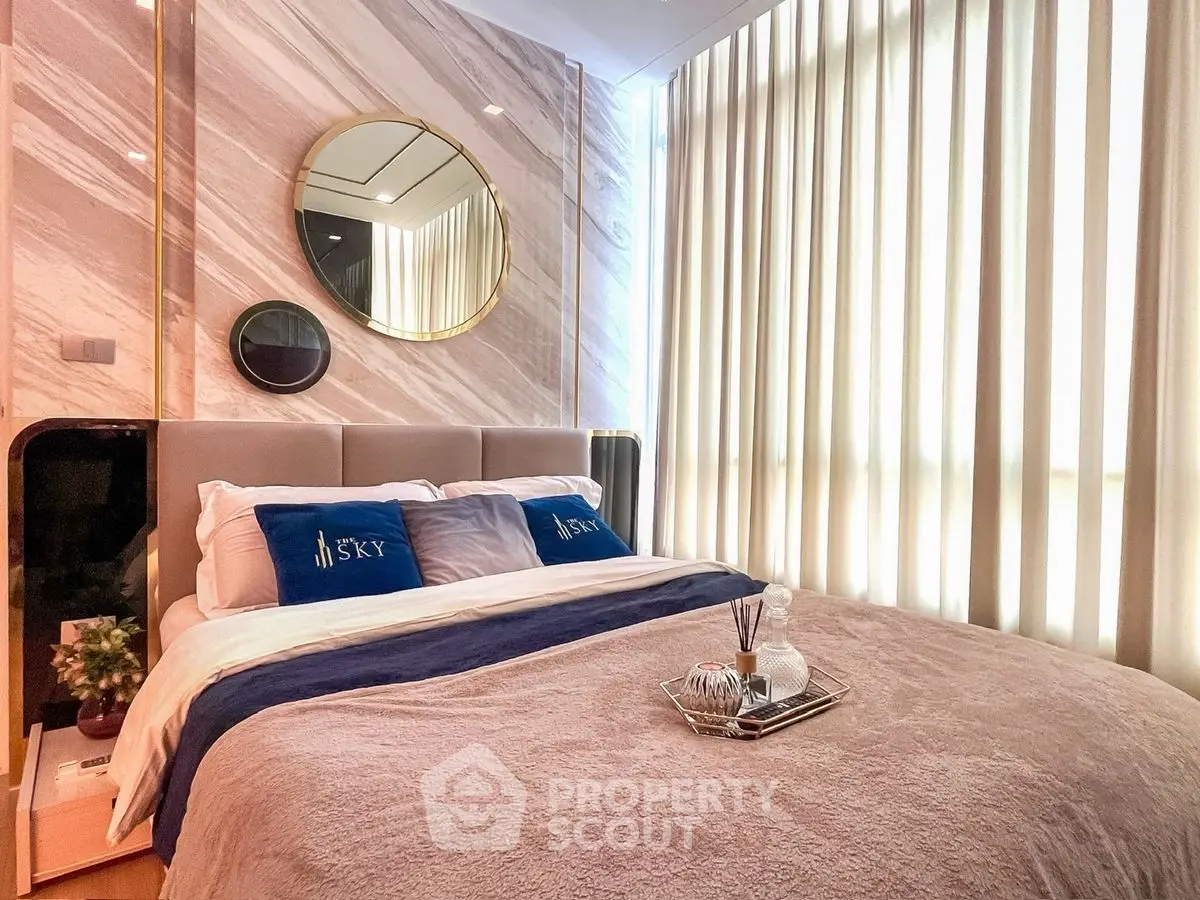 Luxurious bedroom with elegant decor and natural light