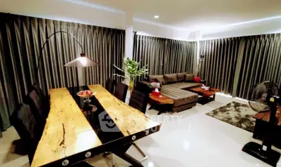 Spacious modern living room with elegant dining area and stylish decor