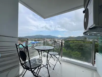 Stunning balcony with panoramic views and elegant outdoor seating, perfect for relaxation and enjoying the scenery.