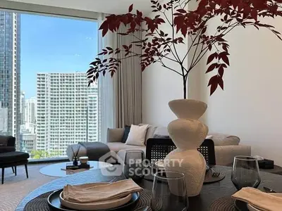 Modern living room with city view and elegant dining setup