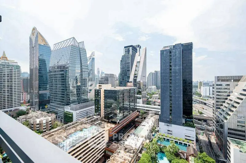 Stunning cityscape view from a high-rise balcony showcasing modern skyscrapers and urban landscape.