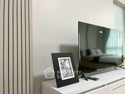 Modern living room with sleek TV setup and stylish decor