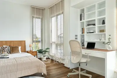Modern bedroom with study area, featuring large windows and stylish decor, perfect for a serene living space.