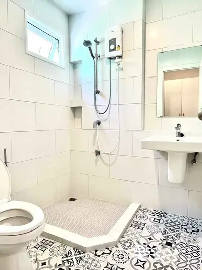 Modern bathroom with stylish patterned tiles and sleek fixtures