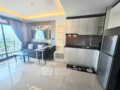 Modern open-layout living room and kitchen with balcony view