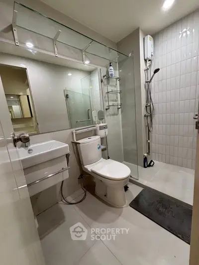 Modern bathroom with glass shower and sleek fixtures