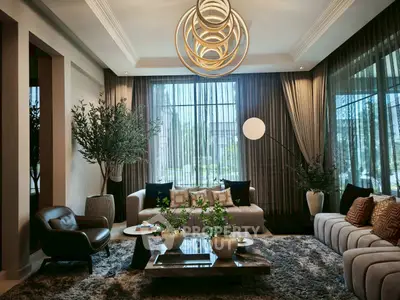 Luxurious living room with modern decor, plush seating, and elegant lighting, perfect for relaxation and entertaining.