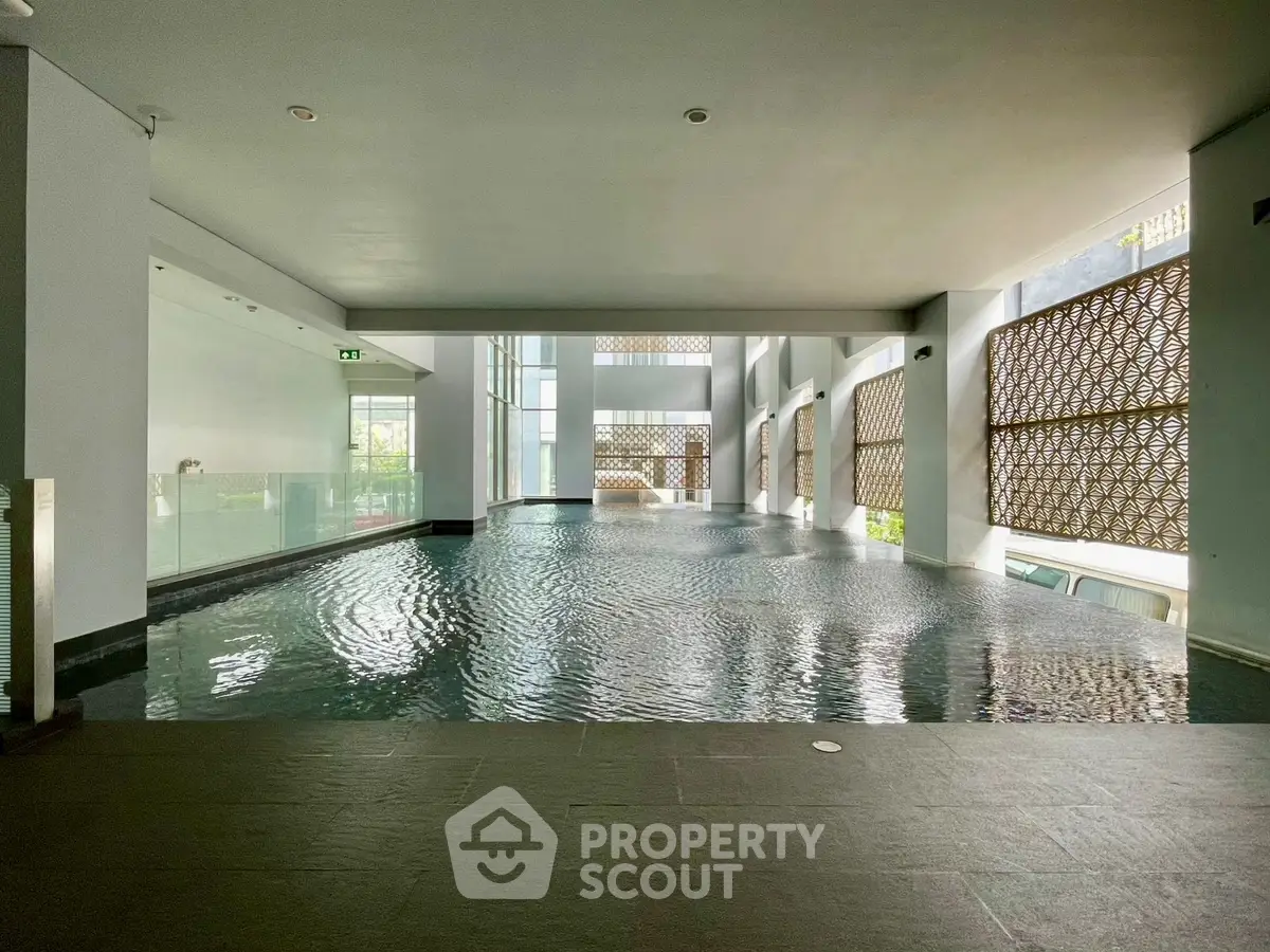 Luxurious indoor pool with modern design and natural light