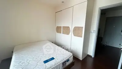 Spacious bedroom with minimalist design and ample closet space