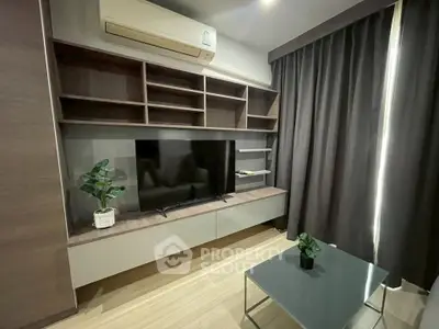 Modern living room with sleek TV unit and air conditioning, perfect for cozy relaxation.