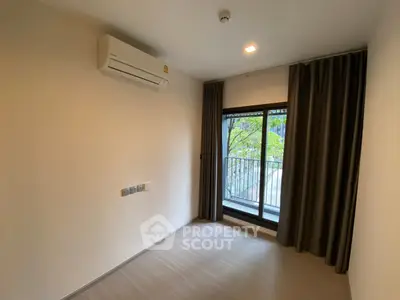Modern unfurnished room with air conditioning and balcony view