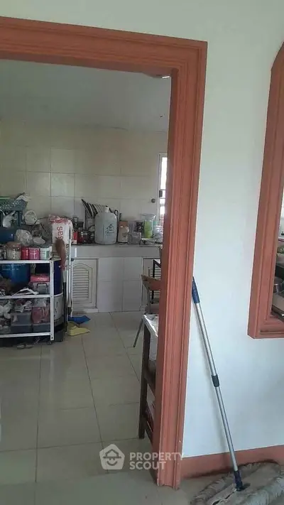Cozy kitchen with closed layout and ample storage space, perfect for culinary enthusiasts.