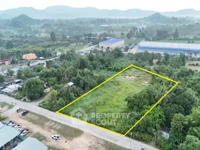 Expansive plot of land for sale with lush greenery and mountain views, ideal for development or investment.