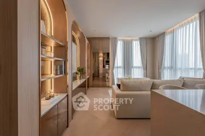 Luxurious modern living room with elegant decor and large windows for natural light.