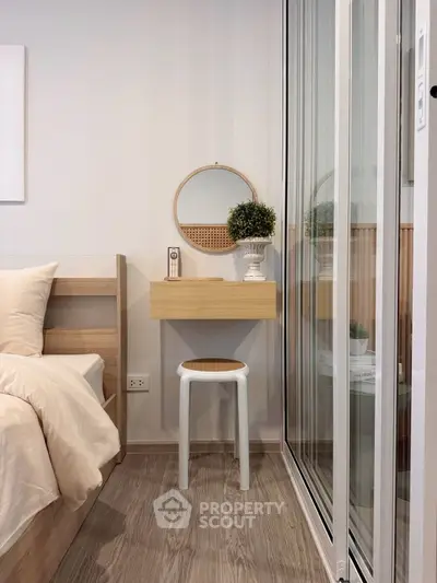 Modern bedroom with minimalist decor and sliding glass doors