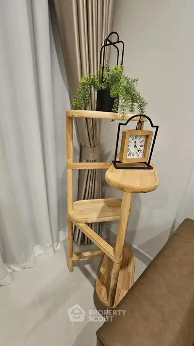 Stylish wooden corner shelf with decor in modern living room setting.