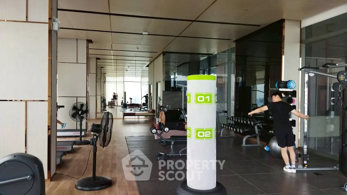 Spacious modern gym with state-of-the-art equipment and sleek design