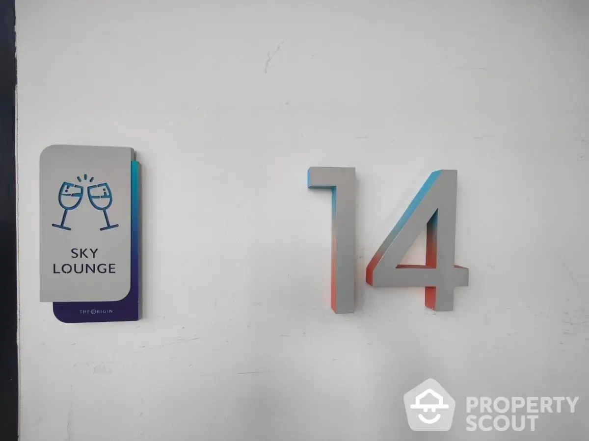 Sky lounge sign with number 14 on a wall, modern design.