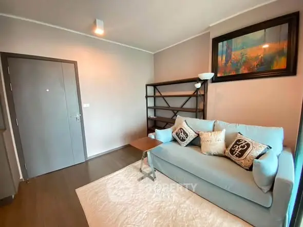 Cozy living room with stylish sofa and modern decor in a contemporary apartment.