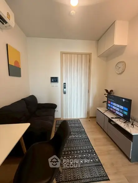 Cozy modern living room with stylish decor and smart TV setup.