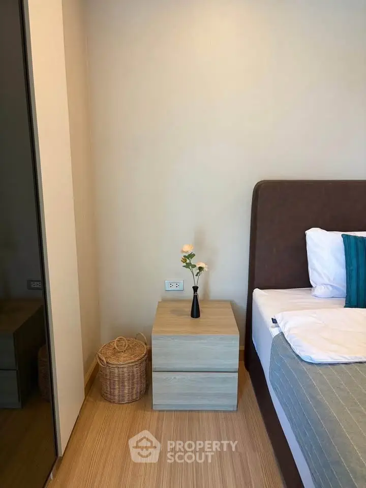 Cozy bedroom corner with modern nightstand and elegant decor