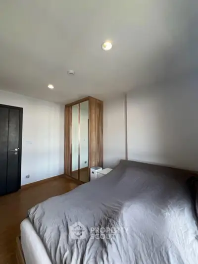 Spacious bedroom with modern design and ample natural light