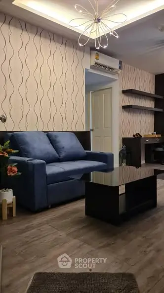 Modern living room with stylish blue sofa and elegant decor