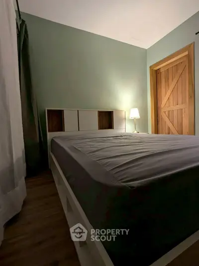 Cozy bedroom with modern decor and wooden accents