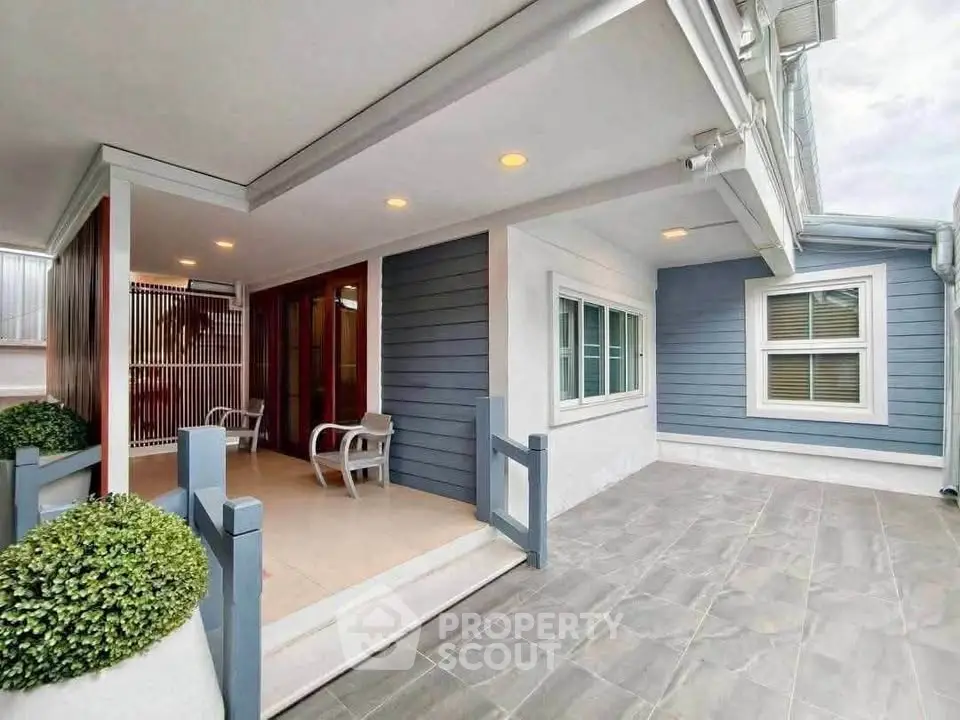 Charming modern home exterior with spacious patio and stylish siding